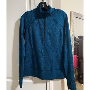 Blue Lululemon Half-Zip with thumb-holes size 8 with zipper pockets in the back